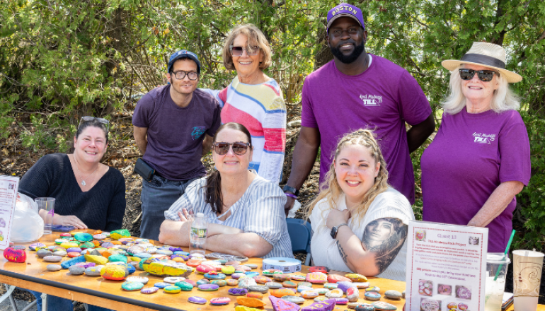 Group picture with stone art on the table
