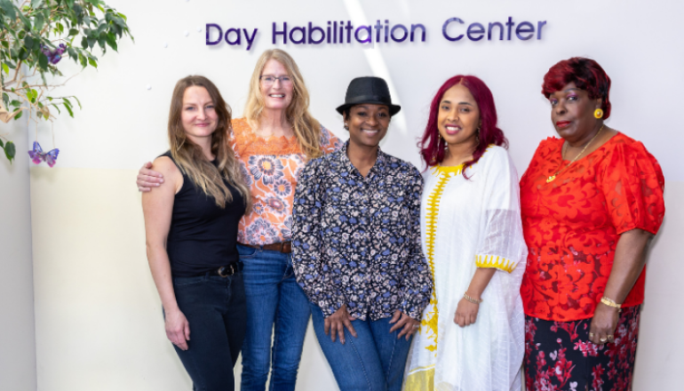 Group Picture with Day Hab Center behind them