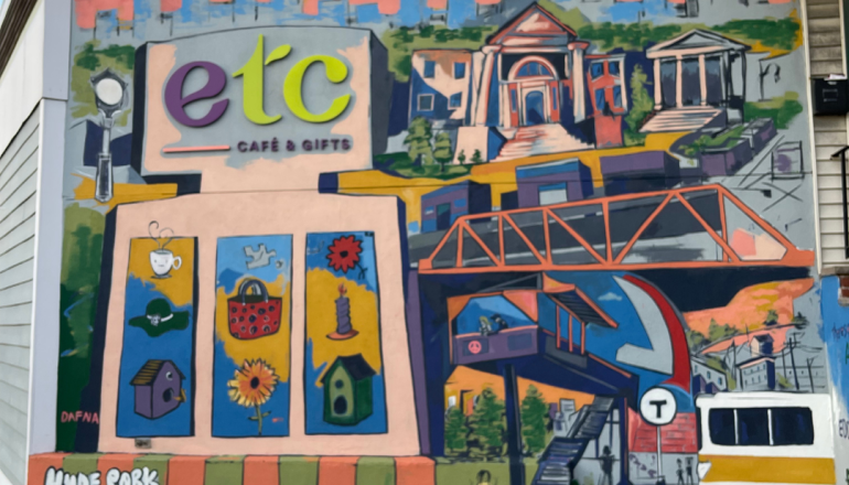 A mural at ETC with very detailed painting of Hyde Park and the City of Boston